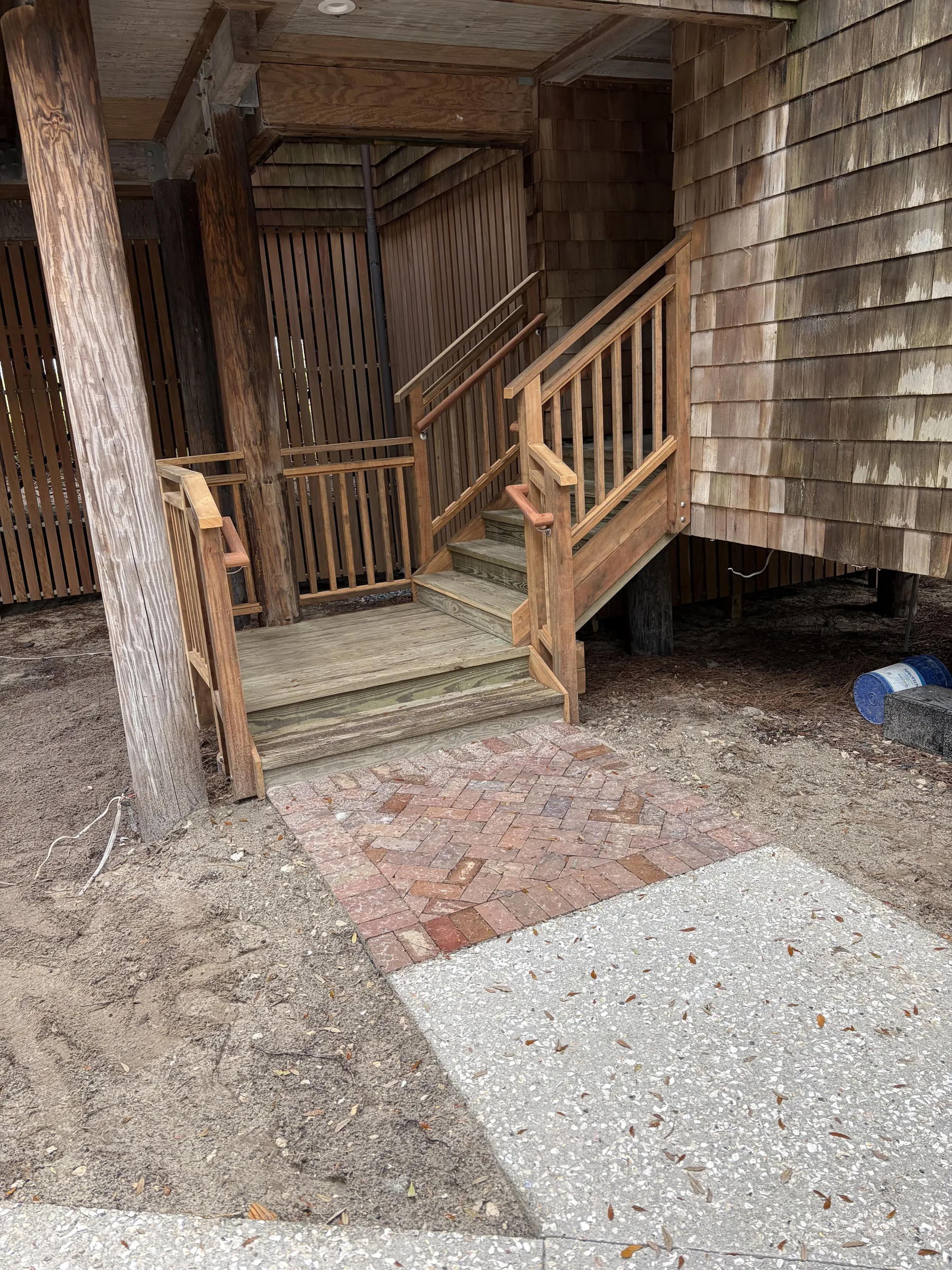 Oceanfront exterior stair renovation progress view